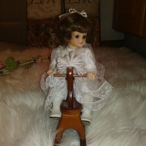 Doll on Rocking horse